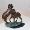 Two Rams on a rock Bronze Statue -  Size: 15"L x 8"W x 16"H.