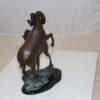 Two Rams on a rock Bronze Statue -  Size: 15"L x 8"W x 16"H.