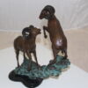 Two Rams on a rock Bronze Statue -  Size: 15"L x 8"W x 16"H.