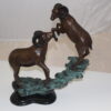 Two Rams on a rock Bronze Statue -  Size: 15"L x 8"W x 16"H.