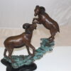 Two Rams on a rock Bronze Statue -  Size: 15"L x 8"W x 16"H.