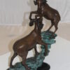 Two Rams on a rock Bronze Statue -  Size: 15"L x 8"W x 16"H.