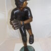 Boy plays baseball Bronze Statue -  Size: 22"L x 12"W x 36"H.