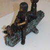 Two kids with dog on log Bronze Statue -  Size: 12"L x 5"W x 8.5"H.