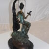 Girl on a swing Bronze Statue -  Size: 15"L x 8"W x 21"H.