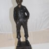 Boy standing Bronze Statue -  Size: 7.5"L x 7.5"W x 23.5"H.