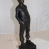 Boy standing Bronze Statue -  Size: 7.5"L x 7.5"W x 23.5"H.