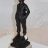 Boy standing Bronze Statue -  Size: 7.5"L x 7.5"W x 23.5"H.