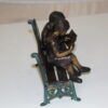 Two kids on bench reading a book - Bronze Statue -  Size: 9"L x 6"W x 8"H.