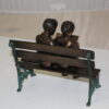 Two kids on bench reading a book - Bronze Statue -  Size: 9"L x 6"W x 8"H.