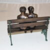 Two kids on bench reading a book - Bronze Statue -  Size: 9"L x 6"W x 8"H.