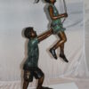 Children-on-swing-Bronze-Statue -  Size: 20"L x 9"W x 39"H.