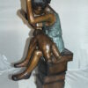 Girl sitting on a stack of books reading a book Bronze Statue -  17"x 18"x 36"H