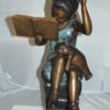 Girl sitting on a stack of books reading a book Bronze Statue -  17"x 18"x 36"H