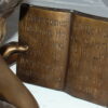 Girl laying reading a book Bronze Statue -  Size: 36"L x 17"W x 18"H.