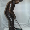 Boy plays golf Bronze Statue -  Size: 14"L x 18"W x 37"H.