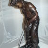 Boy plays golf Bronze Statue -  Size: 14"L x 18"W x 37"H.