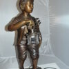 Caddy with light Bronze Statue -  Size: 19"L x 19"W x 42"H.