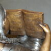 Girl sitting with her dog  on a bench,  reading Bronze Statue - 27" x 39" x 32"H