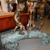 Kid with dog walking on a log Bronze Statue -  Size: 57"L x 18"W x 41"H.