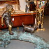 Kid with dog walking on a log Bronze Statue -  Size: 57"L x 18"W x 41"H.