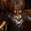 Kid with dog walking on a log Bronze Statue -  Size: 57"L x 18"W x 41"H.