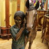 Young Girl and her pony Bronze Statue -  Size: 48"L x 20"W x 48"H.