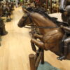 Jockey and Horse Jump a Fence Bronze Statue -  Size: 60"L x 30"W x 51"H.