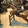 Jockey and Horse Jump a Fence Bronze Statue -  Size: 60"L x 30"W x 51"H.