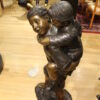 Boy Giving Girl Piggyback Ride Bronze Statue -  Size: 23"L x 16"W x 46"H.