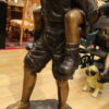 Boy Giving Girl Piggyback Ride Bronze Statue -  Size: 23"L x 16"W x 46"H.