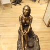 Lady on Stone Bronze Statue -  Size: 33"L x 23"W x 34"H.