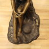 Lady on Stone Bronze Statue -  Size: 33"L x 23"W x 34"H.