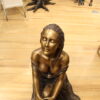 Lady on Stone Bronze Statue -  Size: 33"L x 23"W x 34"H.