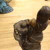 Lady on Stone Bronze Statue -  Size: 33"L x 23"W x 34"H.