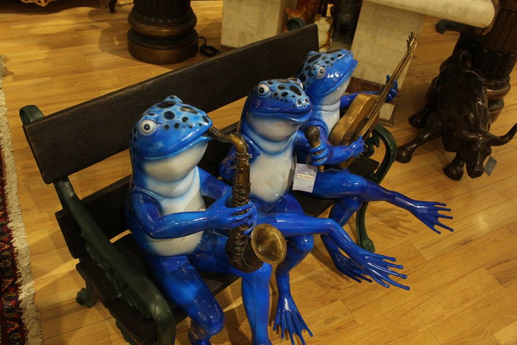 frogs on a bench garden statue