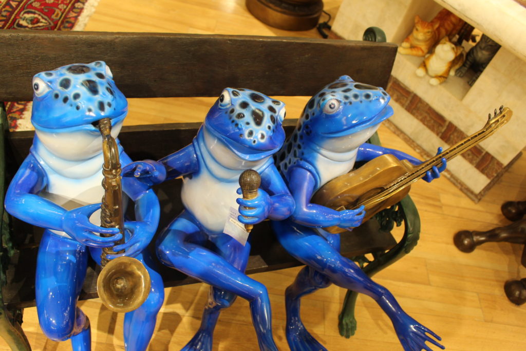 frogs on a bench garden statue