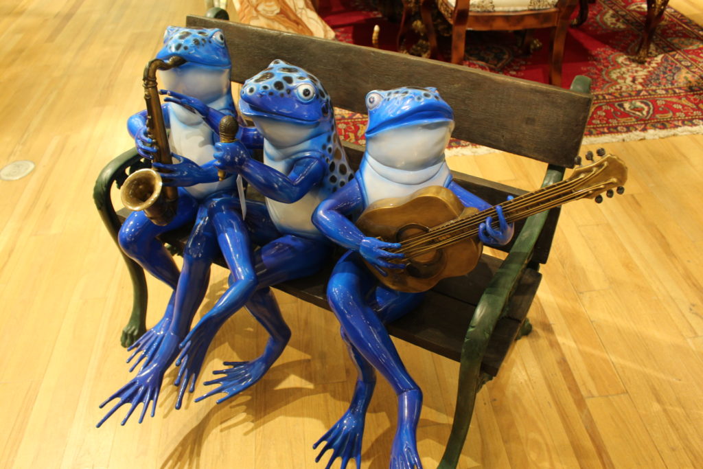 frogs on a bench garden statue