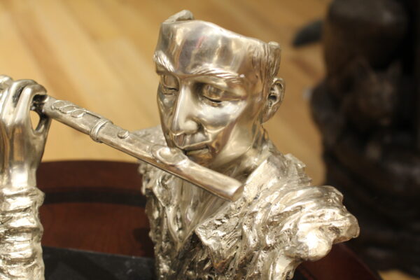 Man playing Flute Bronze Statue -  Size: 10"L x 8"W x 10"H.