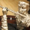 Man playing Flute Bronze Statue -  Size: 10"L x 8"W x 10"H.