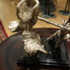 Man playing Flute Bronze Statue -  Size: 10"L x 8"W x 10"H.