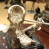 Man playing Flute Bronze Statue -  Size: 10"L x 8"W x 10"H.