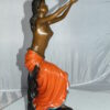 Lady Holds a Bird Up Bronze Statue -  Size: 7"L x 7"W x 20"H.