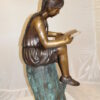 Girl Sitting on a Tree Stump Reading a Book Bronze Statue -  15"L x 17"W x 38"H