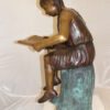 Girl Sitting on a Tree Stump Reading a Book Bronze Statue -  15"L x 17"W x 38"H