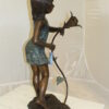 Girl Holding a Flower Fountain Bronze Statue -  Size: 15"L x 15"W x 35"H.