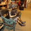 Kids Reading a Book on a Bench Bronze Statue -  Size: 23"L x 38"W x 37"H.