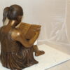 Girl Sitting and Reading a Book Bronze Statue -  Size: 23"L x 15"W x 24"H.