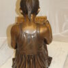 Girl Sitting and Reading a Book Bronze Statue -  Size: 23"L x 15"W x 24"H.