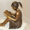 Girl Sitting and Reading a Book Bronze Statue -  Size: 23"L x 15"W x 24"H.